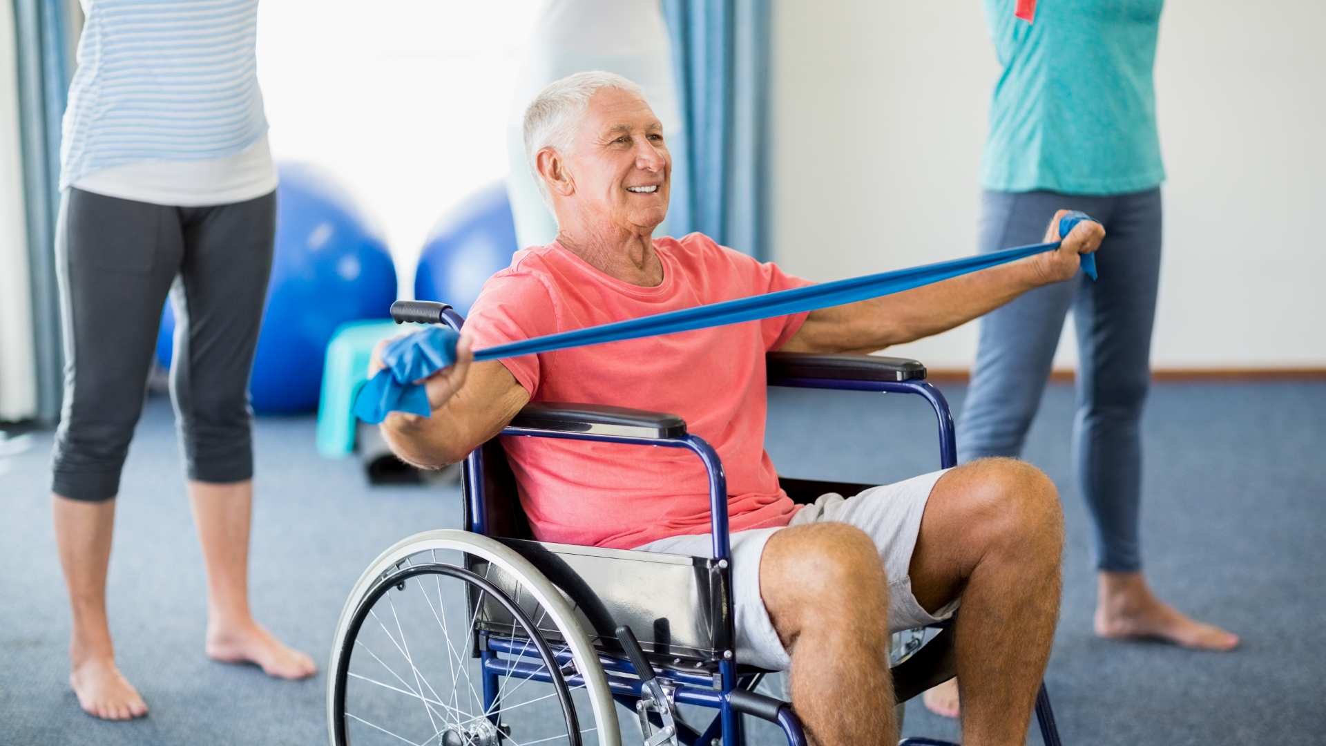 senior in wheelchair using resistance bands