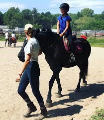 boy recievng horseback riding lesson at silver rock farm