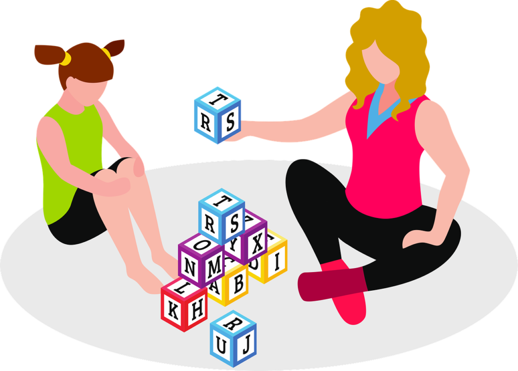 graphic of two girls playing with letter blocks